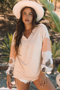 Blouse with puff sleeves, featuring a relaxed fit, stylish polka dot and palm leaf patchwork sleeves.
